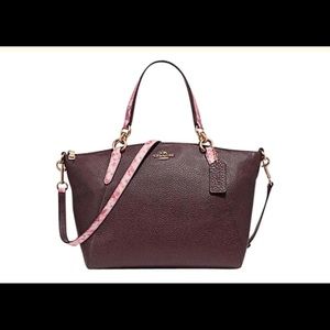 Gently used with matching wallet.